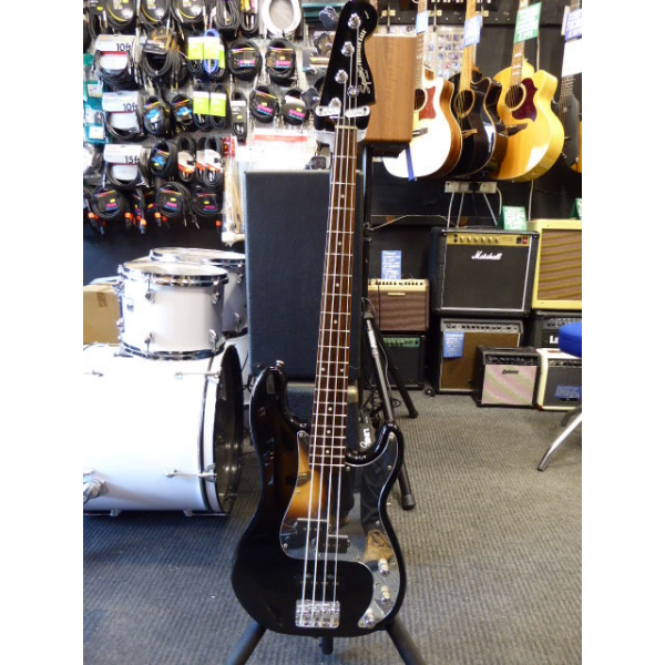 <p>Limited edition PJ bass with black gloss finish, matching headstock, and mirror scratchplate.</p><p>Condition: A few small dents and scrapes.</p>
