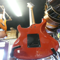 Quality strat copy with powersound pickups, smooth satin neck, beveled neck heel, and lovely scarlet red finish.