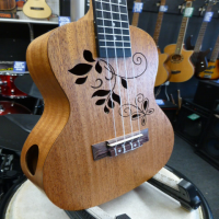 <p>Pretty looking concert ukulele with flower soundholes and side soundhole.</p><p>Includes bag.</p>