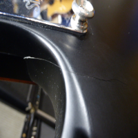<p>Entry-level SG copy with bolt-on neck.</p><p>Condition: Neck pocket cracks in the finish, and missing cap on one of the volume knobs, nothing major.</p>