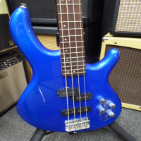 <p>Excellent lightweight 4-string bass guitar with active circuit, hybrid pickup configuration, blue metallic finish, and more!</p><p>Great condition.</p>