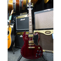 <p>Quality Korean-made vintage SG in cherry red, with gold hardware, set-neck construction, Wilkinson pickups, and great playability.</p><p>Condition: Various marks, but nothing major.</p>
