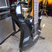 <p>Lovely double cut electric guitar with twin humbucking pickups, slim neck profile and low action.&nbsp; Great for beginners!<br /></p><p>Condition: Lots of marks on the body, unoriginal back plate, plenty of fret wear, missing truss rod cover, unoriginal tremolo arm, hence the low price!</p>