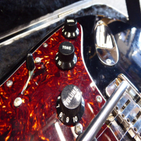 <p>2012 Fender American Standard Stratocaster in near mint condition.&nbsp; There are very fine surface marks that one would expect to see on a black gloss finish compared to any other colour, but otherwise this is like new!</p><p>It has received a stone setup from Andy Warnock and plays like butter!&nbsp; It also has a few upgrades, including Schaller locking machine heads, a set of low noise Lace Sensor Gold pickups, Fender 25db Stratocaster Mid Boost Kit for Eric Clapton Strat installed, and a Fender ultra/deluxe trem bridge with snap-in arm.</p><p>Includes original Fender hard case and manual.</p>