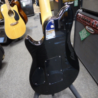 <p>Affordable copy of a Musicman Axis Eddie Van Halen signature guitar with licensed Floyd Rose style trem system.</p><p>Good condition.</p>