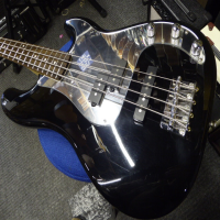 <p>Limited edition PJ bass with black gloss finish, matching headstock, and mirror scratchplate.</p><p>Condition: A few small dents and scrapes.</p>