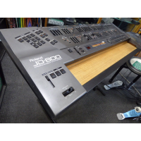 <p>Legendary digital synthesizer, released in 1991.</p><p>JD800s are known to suffer from the dreaded 'red glue' issue - the glue used to hold the key weights in place goes runny over time, damaging both the keyboard and the electronics.&nbsp;</p><p>This one's had the keyboard stripped out and all residue of the red glue removed.</p><p>Modded as a custom expander module with wooden shelf. The modification is discrete, with the shelf slotting into the rails where the keyboard assembly would normally go. No holes drilled!<br /><br />Powerful synthesis with over 60 front panel controls.<br />24 voice.<br />Sample-based oscillators and a fully digital signal path.<br />108 built-in waveforms.<br />64 internal patches, each consisting&nbsp; of four 'tones' which can be blended together.<br />Built-in effects include Reverb, Phaser, Distortion and Chorus.<br />Multi mode allows 5 sounds on independent midi channels plus a 'special' patch which allocates different waveforms individual keys for use with drum kits.<br /><br />As a bonus, this unit also comes with the SL-JD80-02 Drums &amp; Percussion Dance PCM and RAM cards.&nbsp;<br />These offer an extra bank of 64 synth sounds on the RAM card and 56 new waveforms on the PCM card, featuring drum samples from the TR-808, TR-909 and CR78 drum machines.<br />Second bonus: an additional M256E RAM card, offering another bank of 64 synth sounds.<br /><br /><br /></p>