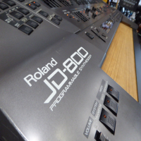 <p>Legendary digital synthesizer, released in 1991.</p><p>JD800s are known to suffer from the dreaded 'red glue' issue - the glue used to hold the key weights in place goes runny over time, damaging both the keyboard and the electronics.&nbsp;</p><p>This one's had the keyboard stripped out and all residue of the red glue removed.</p><p>Modded as a custom expander module with wooden shelf. The modification is discrete, with the shelf slotting into the rails where the keyboard assembly would normally go. No holes drilled!<br /><br />Powerful synthesis with over 60 front panel controls.<br />24 voice.<br />Sample-based oscillators and a fully digital signal path.<br />108 built-in waveforms.<br />64 internal patches, each consisting&nbsp; of four 'tones' which can be blended together.<br />Built-in effects include Reverb, Phaser, Distortion and Chorus.<br />Multi mode allows 5 sounds on independent midi channels plus a 'special' patch which allocates different waveforms individual keys for use with drum kits.<br /><br />As a bonus, this unit also comes with the SL-JD80-02 Drums &amp; Percussion Dance PCM and RAM cards.&nbsp;<br />These offer an extra bank of 64 synth sounds on the RAM card and 56 new waveforms on the PCM card, featuring drum samples from the TR-808, TR-909 and CR78 drum machines.<br />Second bonus: an additional M256E RAM card, offering another bank of 64 synth sounds.<br /><br /><br /></p>